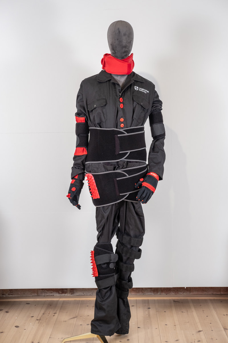 Osteoarthritis suit which shows extra strapping and constriction bands around various limbs on the body